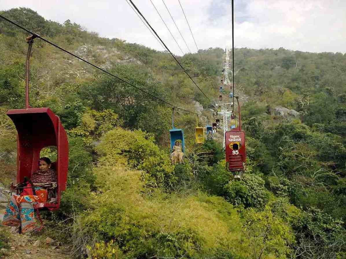Rajgir ropeway ascending toward the Ratnagiri Hill with sprawling valley views.